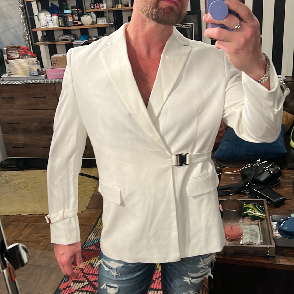 Gorgeous white blazer with interesting silver buckle clasps on stomach & wrists